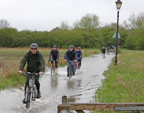 cyclists-water